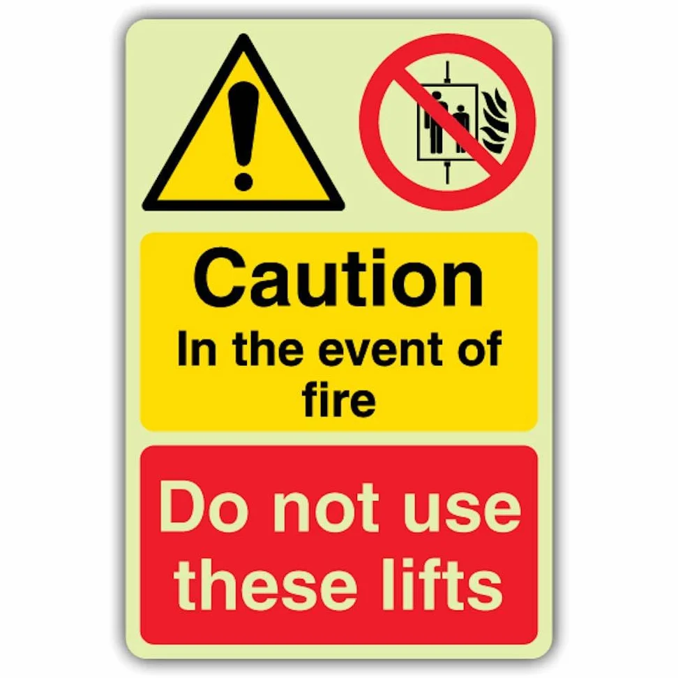 Cartello di sicurezza con scritta "V Safety Glow In The Dark Caution in the Event of Fire Do Not Use These Lifts", 300 x 450 mm, realizzato in vinile autoadesivo triplo fosforescente, segnaletica